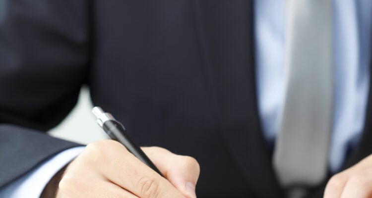 Man filling out TD-1000 form in Denver, CO